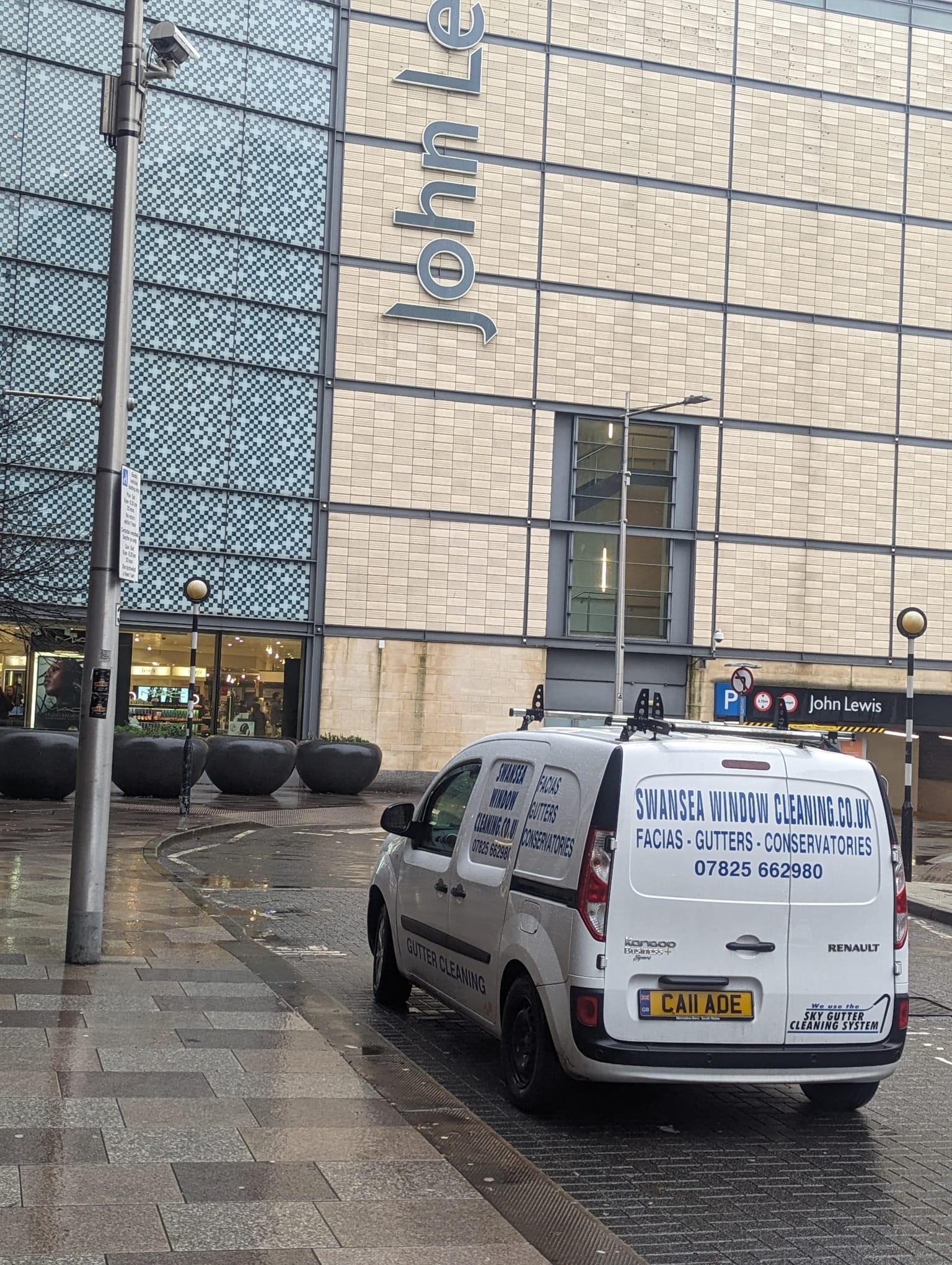 Swansea Window Cleaning branded van parked on location in the city centre